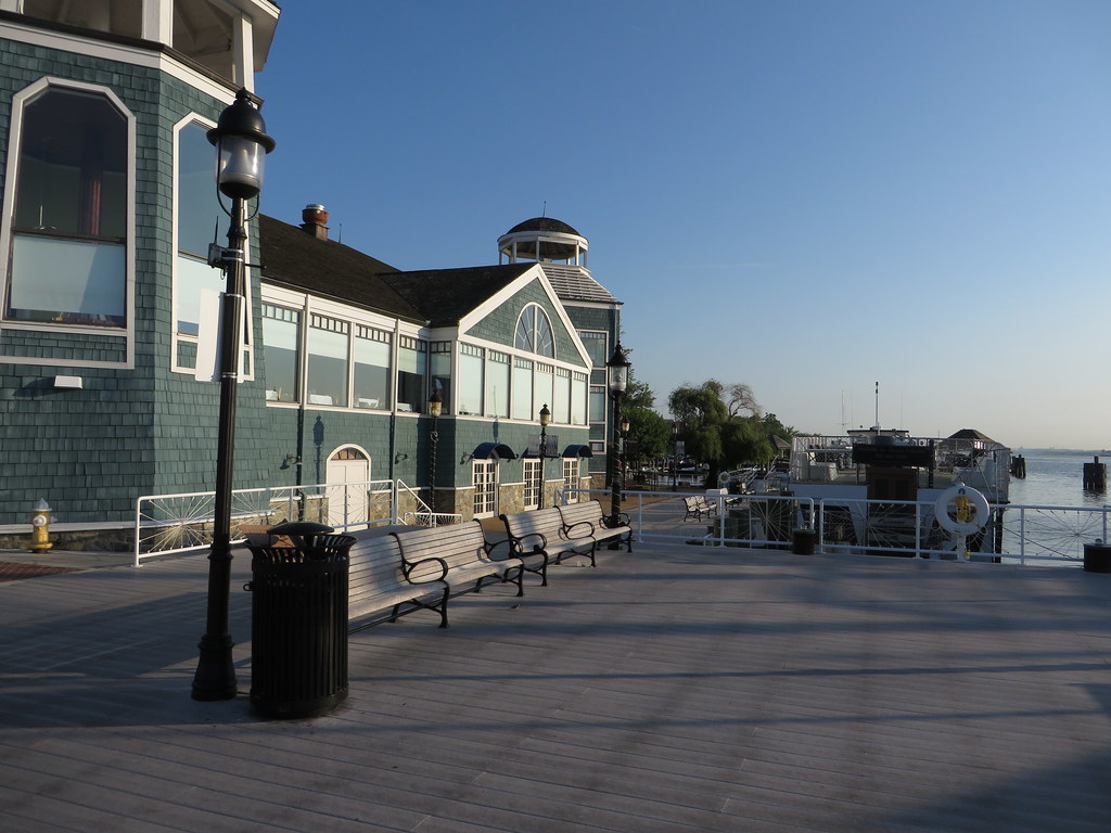 Waterfront shopping and dining district with boats along the marina