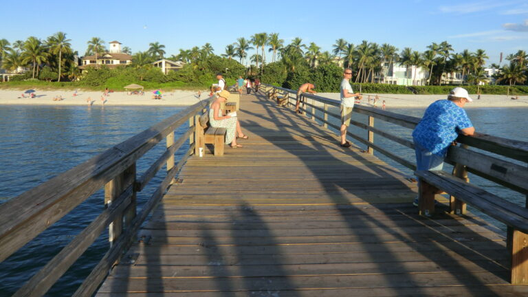 Naples Pier stretching over the Gulf of Mexico at sunset